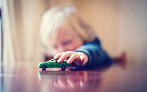boy-playing-with-toy-car.jpg
