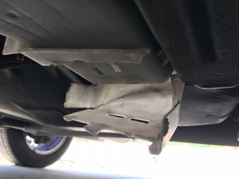 Plastic panel clearance under car